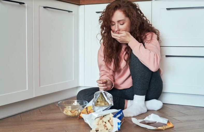 A lady Eating Snacks